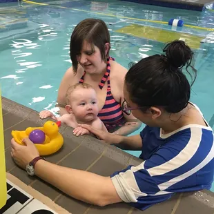 Learning to grab the side of the pool.