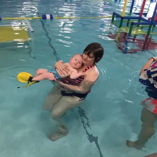 Our first attempt at a back float. Getting used to the water. This was an orientation class.