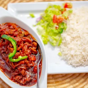 Awaze Tibbs 
Cubes of tender beef marinated and cooked with tomato, Jalapeno, garlic and berbere sauce.