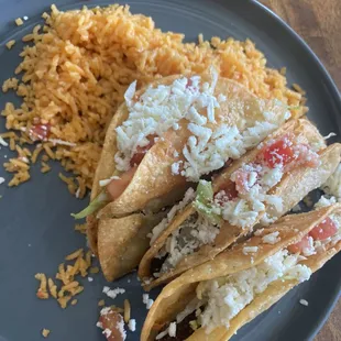 Fried beef tacos and rice.