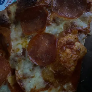 a slice of pepperoni pizza