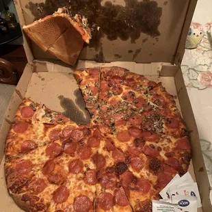 a half eaten pepperoni pizza