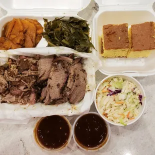 Brisket and pulled pork plate with yam, collard greens, cornbread. Plus 8 oz coleslaw. IG: @take.a.bite.with.me