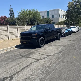 a pickup truck parked on the side of the road