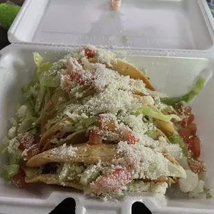 A plate of four fried tacos ground beef