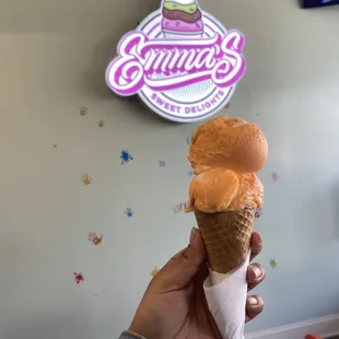 Orange cream ice cream cone