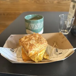 Egg and cheese biscuit, and latte