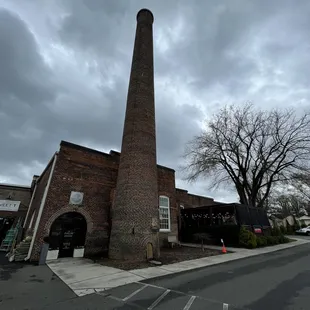 a brick building with a chimney