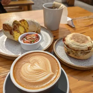 breakfast burrito, the one- handed, flat white, tea.