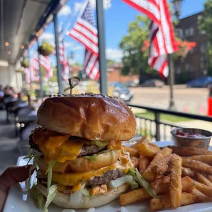 The Big Mick Burger - 2 quarter pound all beef patties, special sauce, lettuce, onions, pickles, American cheese, on a toasted bun!