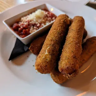 Brooklyn Mozz Sticks. $15. Five crispy hand-stretched mozzarella sticks, red sauce.