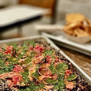 a square pizza on a cooling rack
