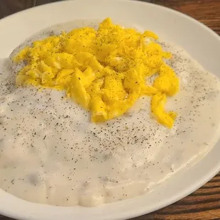 Biscuits and gravy topped with scrambled eggs. Delicious!