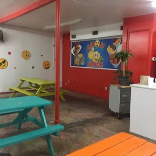 a brightly colored table and benches