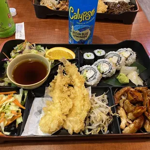 a bento box with a variety of food items