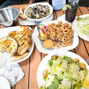 HH items. Big portions, great prices, and so tasty!  Steamed manila clams, crab shrimp &amp; artichoke dip, calamari fritti, caesar salads.