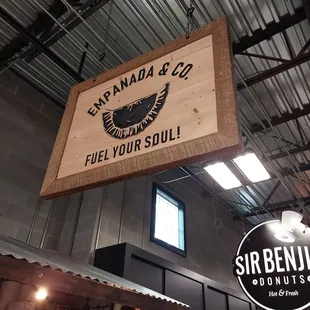 a sign hanging from the ceiling