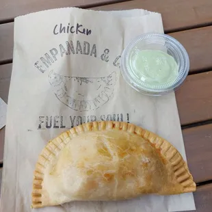 a chicken empanada and a drink