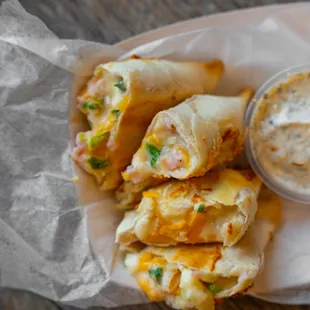 Ham and Cheese empanadas with garlic sauce.