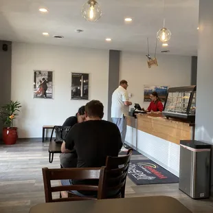 two people sitting at a counter