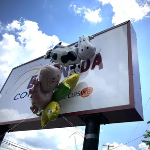 a cow and a cow on a sign