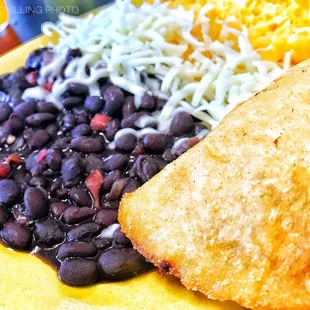 Ground Beef &amp; Potato Empanada w/ Rice, Beans and Cheese.