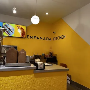 a yellow counter and yellow walls