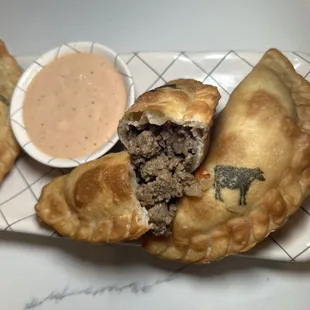 Beef empanada and pink sauce