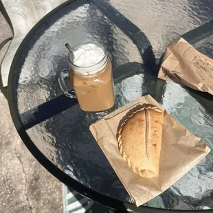 Chicken empanada on the right (coffee was made at home)