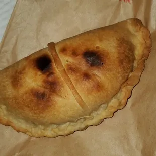 a piece of bread on a brown paper bag