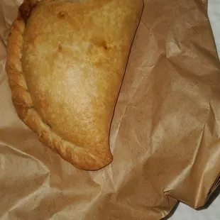 a piece of food in a brown paper bag