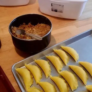 a pan of empanadas on a table