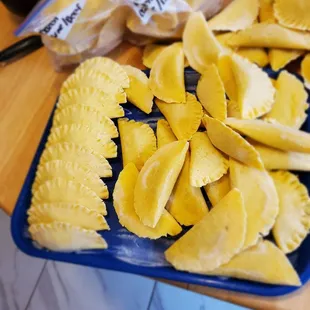 a blue plate of empanadas
