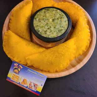 a bowl of salsa on a plate
