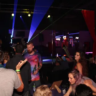 a group of people in a nightclub