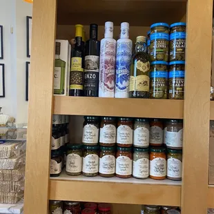 a shelf of spices and condiments