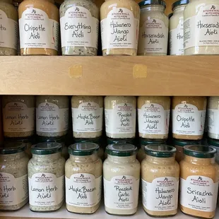 a shelf full of jars of food