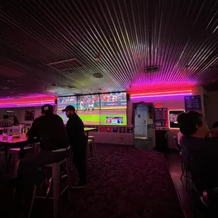 Bar tables and multiple tv screens throughout