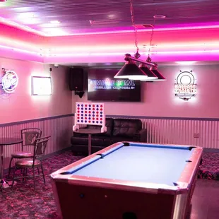 a billiards room with a pool table