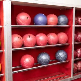 bowling balls and bowling balls on shelves