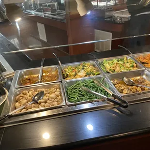 a variety of food items in a buffet