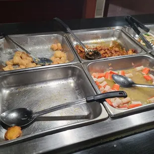 a variety of food items in a buffet