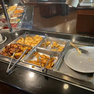 a variety of food items in a buffet