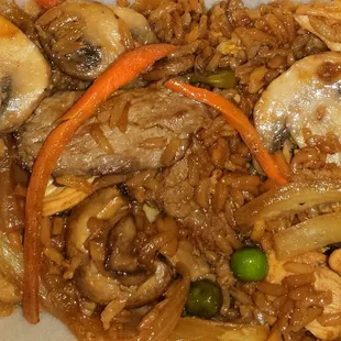 Chicken and beef from the hibachi with mushrooms and carrots.