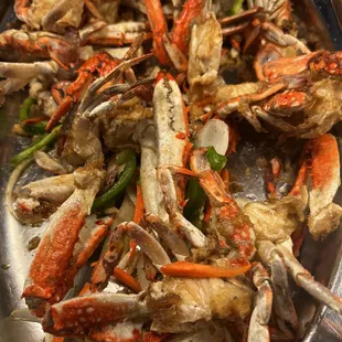 a plate of crab legs and vegetables