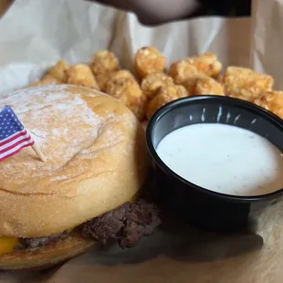 an american flag on top of a hamburger