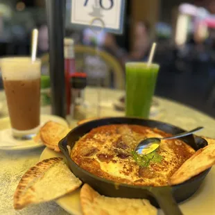 Shakshouka -Moroccan style baked eggs in spicy tomato stew