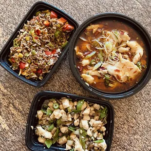 three containers of food on a table