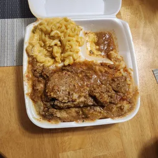 a meal in a styrofoam container