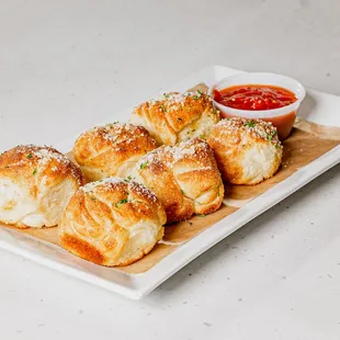 a platter of cheese rolls